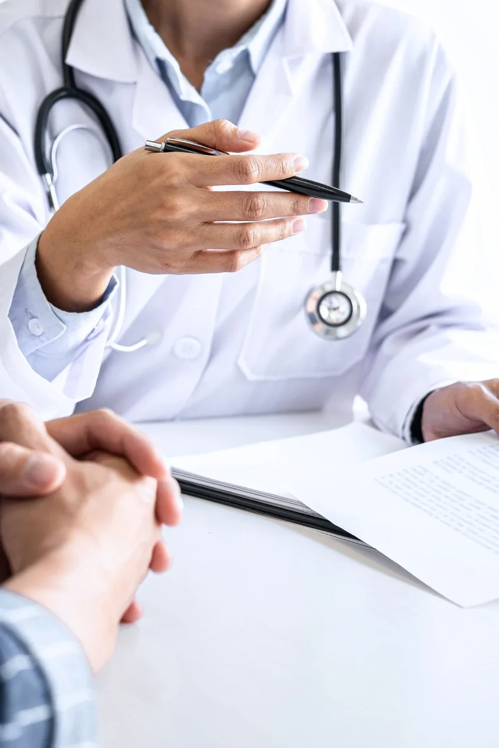 US medical treatment travel visa — a doctor consulting with a patient