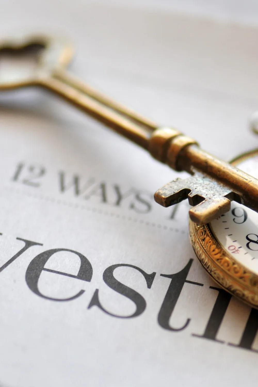 Travel to the US before an investment or work visa — an antique key and pocket watch
